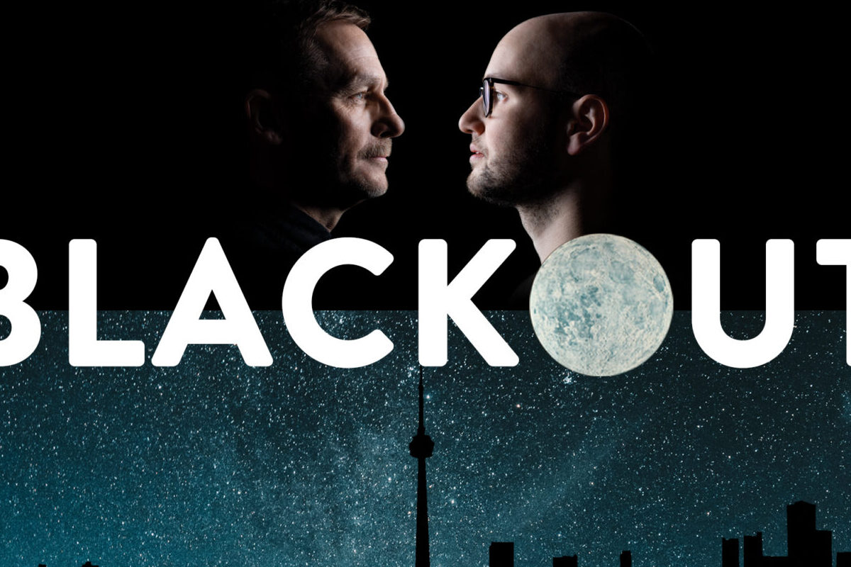 Dramatic profiles of performers Steven Gallagher and Anton Lipovetsky facing each other over the title BLACKOUT and a silhouette of the Toronto skyline against a star filled night sky on a blue and black background.