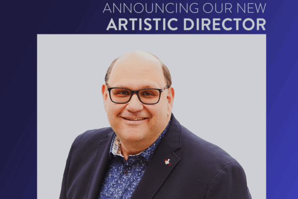 Graphic with text that reads, "announcing our new artistic director Michael Rubinoff" with Michael's headshot in the middle, The Musical Stage Company logo in the top left corner, and a gradient blue background. Michael wears glasses, a suit jacket and blue patterned collared shirt.